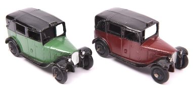 2 Dinky Toys TAXI (36g). An example in maroon and black and another in green and black, both with
