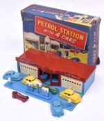 A rare 1950's plastic Petrol Station with 4 Cars by Kleeware. Building in blue plastic with maroon