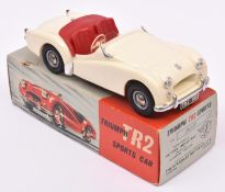 A Victory Industries 1:18 scale battery operated model of a Triumph TR2. Moulded plastic body in