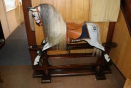 A traditional English hand carved children's wooden rocking horse by F.H. Ayres. Supplied by