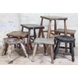 A group of seven wooden stools, heights ranging from 24.5cm to 53.5cm.