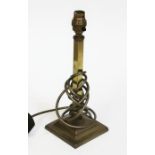 A brass table lamp with weighted base, height 30cm.