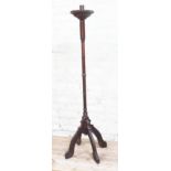 A church turned oak candle stand, height 138cm.