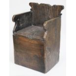 A child's 18th century elm chair of primitive box form with scroll back and arms, width 32cm,