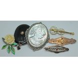 A mixed lot comprising five brooches and a pendant.