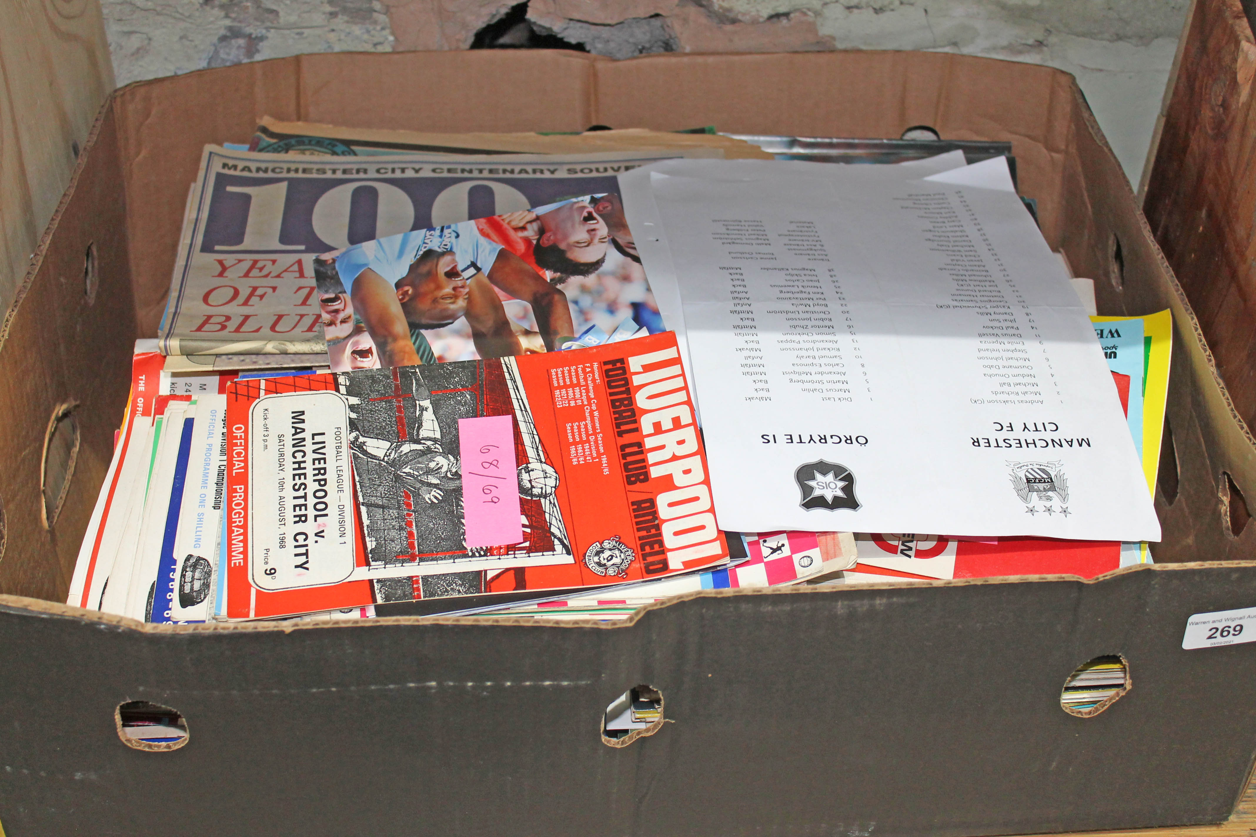 A box of football programmes.