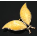 A Norwegian silver and yellow enamel leaf brooch designed by Willy Winnaess for David Andersen,
