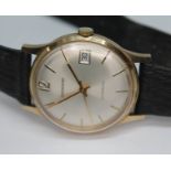 A 1970s hallmarked 9ct gold Garrard automatic wristwatch, having signed champagne dial, gold tone