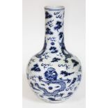 A Chinese blue and white bottle vase decorated with dragons and clouds, four character mark to base,