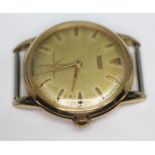 A 1950s Tissot gold plated wristwatch having signed champagne dial with natural patina, gold tone