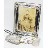 A mixed lot of hallmarked silver comprising two decanter labels and a photograph frame together with