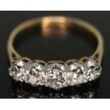 An early 20th century five stone diamond ring, the central old European cut stone weighing approx.