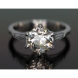 A diamond solitaire ring, the stone weighing approx. 1.86 carats, diamond set shoulders, crafted