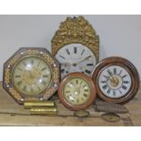 A group of four continental wall clocks.
