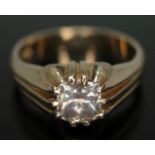 A gypsy set diamond ring, the cushion cut stone weighing approx. 1.40ct, hallmarked 9ct gold band,