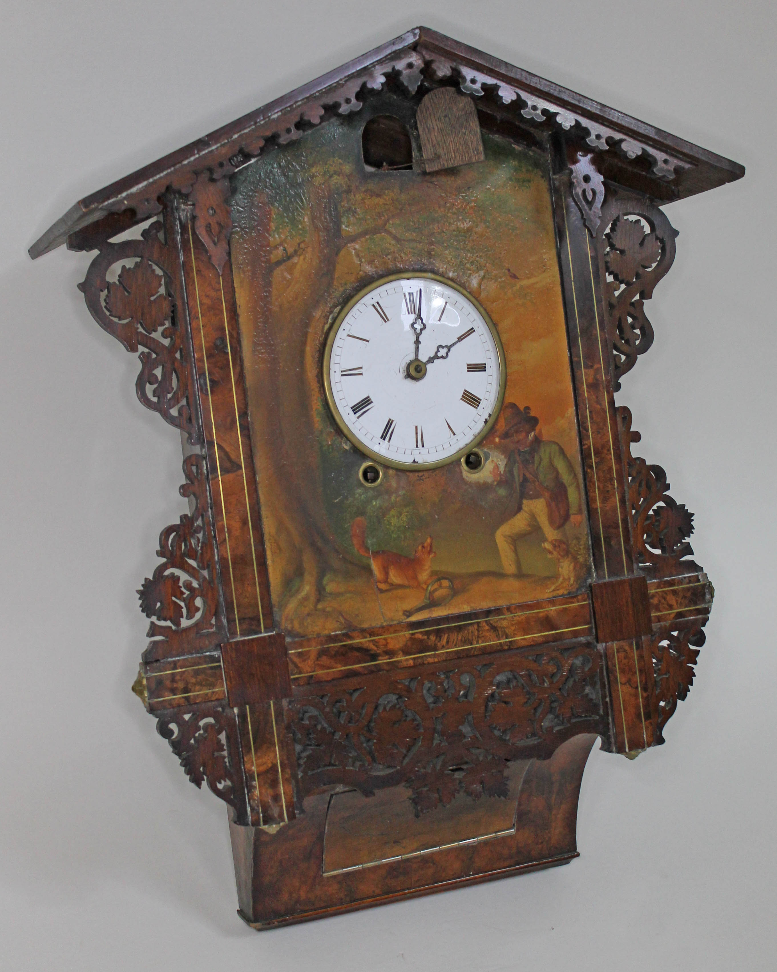 A 19th century Black Forest walnut cuckoo clock, chalet style case with fretwork, 4 1/4" dial
