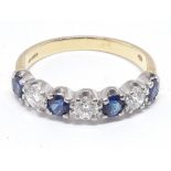 A hallmarked 18ct gold seven stone diamond and sapphire ring, gross wt. 3.05g, size M.