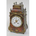 A French late 19th century Louis XIV style gilt metal mounted tortoiseshell mantel clock, the enamel