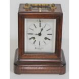 A French late 19th century marquetry inlaid rosewood mantel clock, gilt metal handle and bevelled