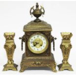 A late 19th century gilt cast brass clock garniture, height 40cm.