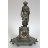 A French spelter mantel clock, height 50cm.