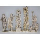 A group of five Japanese Meiji period carved ivory okimono, heights ranging from 16cm to 22cm.
