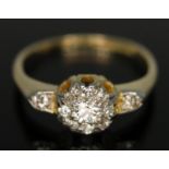 An Edwardian diamond cluster ring, the central old European cut stone weighing approx. 0.12ct,