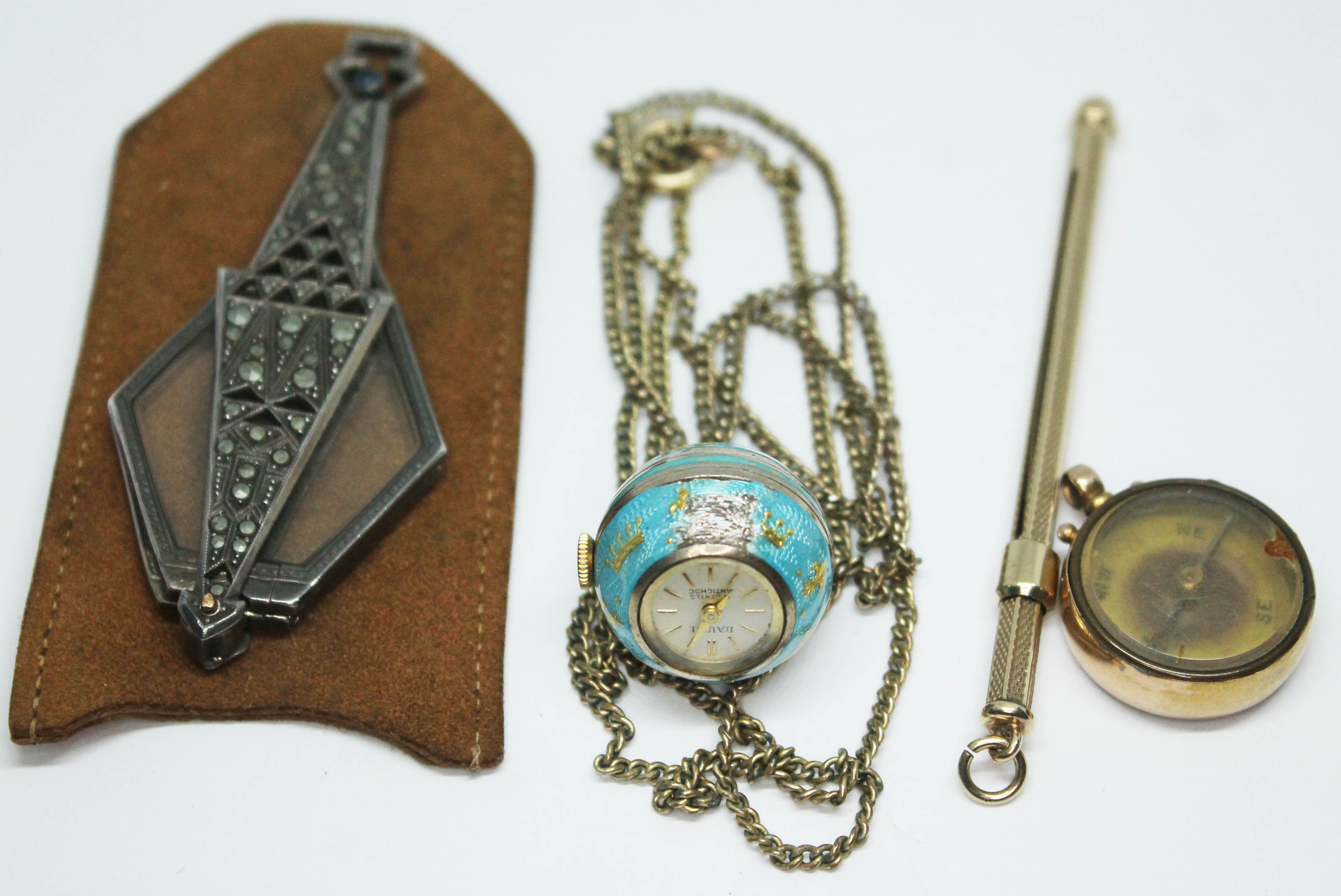 A mixed lot comprising an Art Deco marcasite set lorgnette, a spherical pendant watch, a yellow