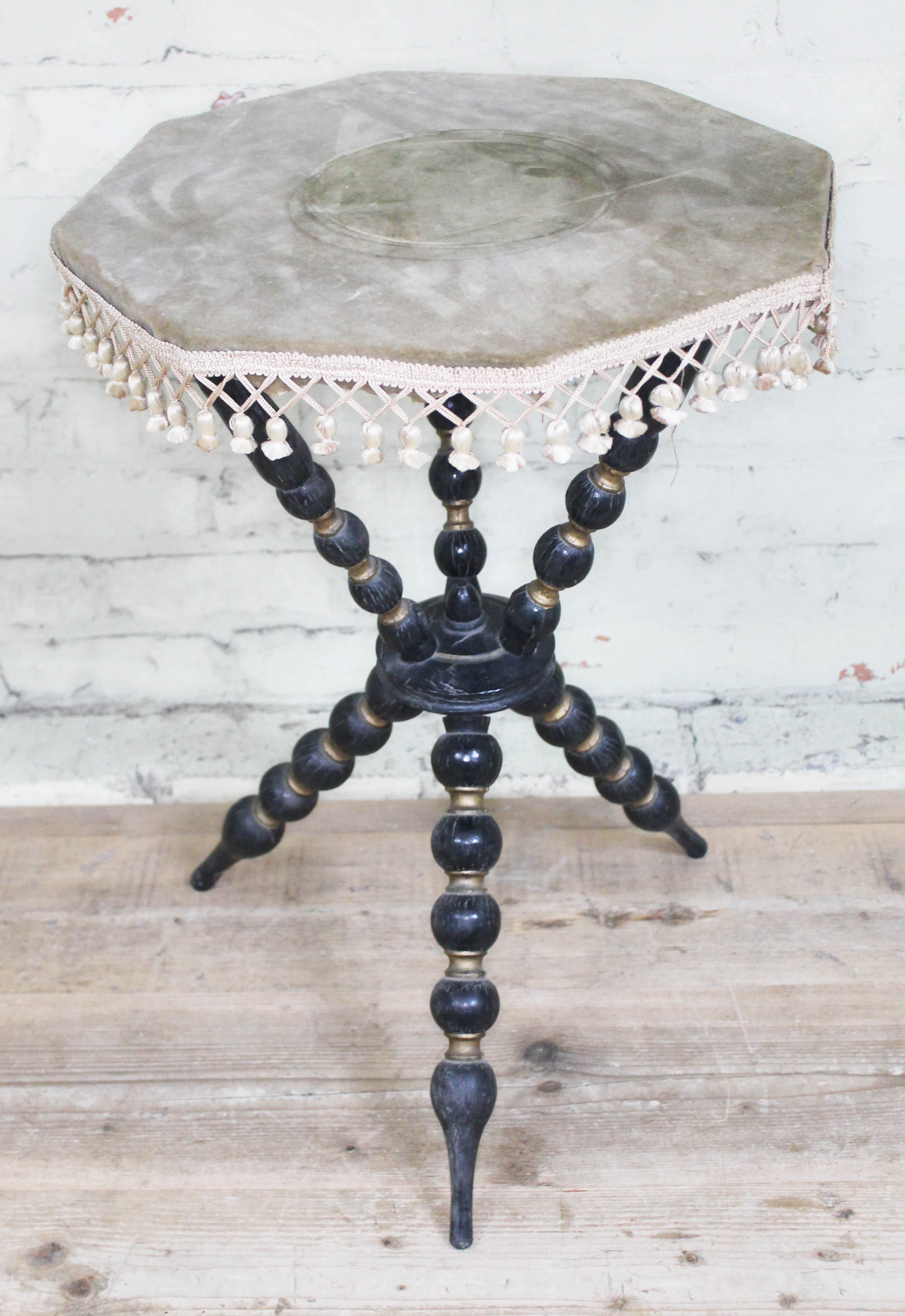 A Victorian parcel gilt and ebonised Gypsy style table, height 66cm.