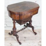 A Victorian walnut games table with fold over top revealing chess, backgammon and cribbage, height