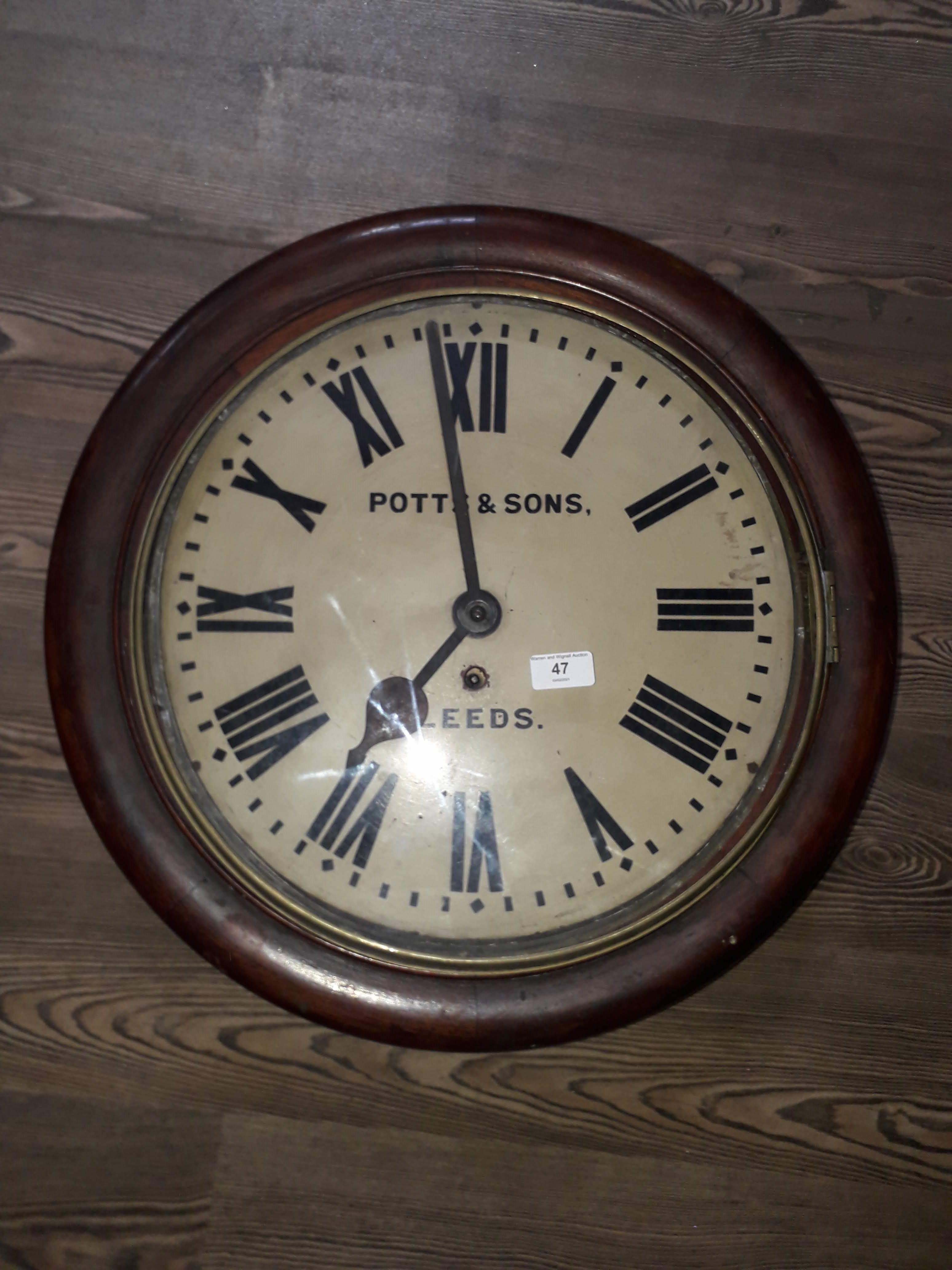 A late Victorian oak wall clock, the 16" dial painted with Roman numerals and signed Potts & Sons