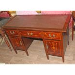 An Edwardian inlaid mahogany desk, length 128cm, depth 55cm & height 74cm.