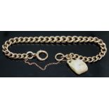 A hallmarked 9ct gold link bracelet with hard stone charm, length 18cm, wt. 22.13g.