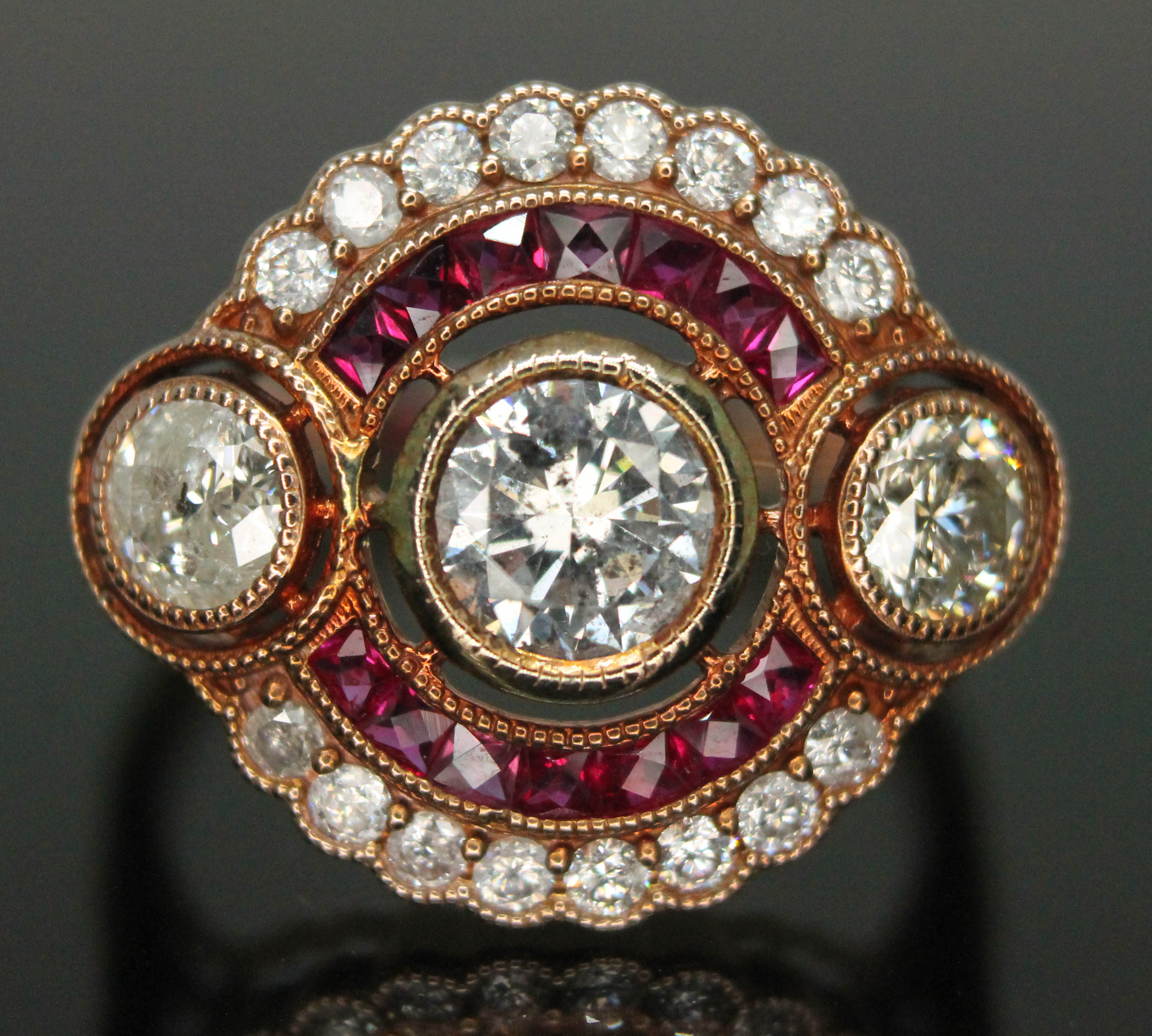 An Art Deco style diamond and ruby cluster ring, total approx. diamond wt. 1.02ct, band marked '