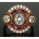 An Art Deco style diamond and ruby cluster ring, total approx. diamond wt. 1.02ct, band marked '