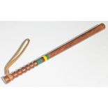 A truncheon painted with Pan African bands, length 61cm.