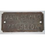 A cast plate MAIN SEWER ABOUT 7FT BELOW 22.5cm x 10.5cm