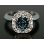 A sapphire and diamond ring, the central round brilliant deep blue sapphire weighing approx. 1.38ct,