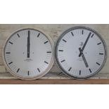A pair of International Time Recording Co LTD round wall clocks, total diam. 50cm each.