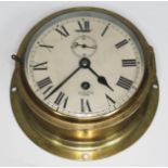 A Smiths Astral brass ship's bulhead clock, total diam. 20.5cm.