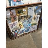 A framed picture of postcards. Live bidding available via our website, if you require P&P please