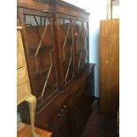 A reproduction mahogany breakfront cabinet bookcase with secretaire drawer Live bidding available