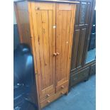 A pine wardrobe, h180cm, w75cm, d53cm. Live bidding available via our website, if you require P&P