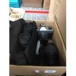 Praktica MTLS camera, 55-200mm zoom lens and 7-21x40 Binoculars. Live bidding available via our