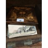 An inlaid box with collection of postcards Live bidding available via our website, if you require