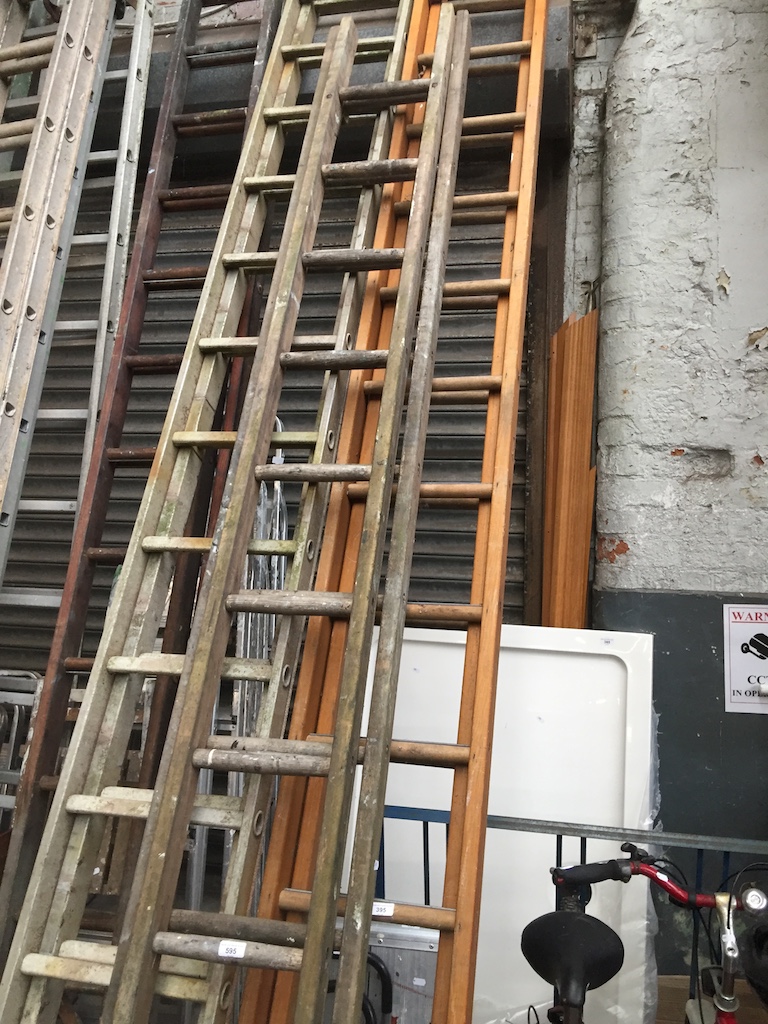 A set of wooden extending ladders Live bidding available via our website, if you require P&P