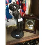 A bronzed golfing figure and a mantle clock Live bidding available via our website, if you require