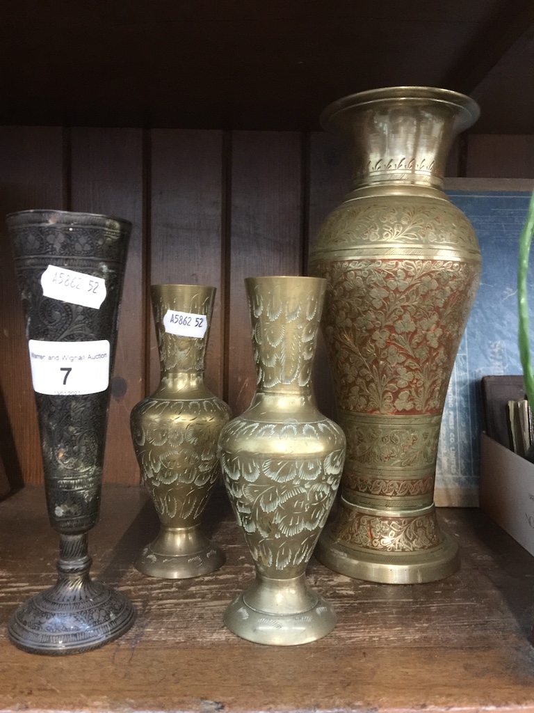 A quantity of eastern brass vases Live bidding available via our website, if you require P&P