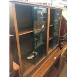 A bookcase with glass sliding doors Live bidding available via our website, if you require P&P