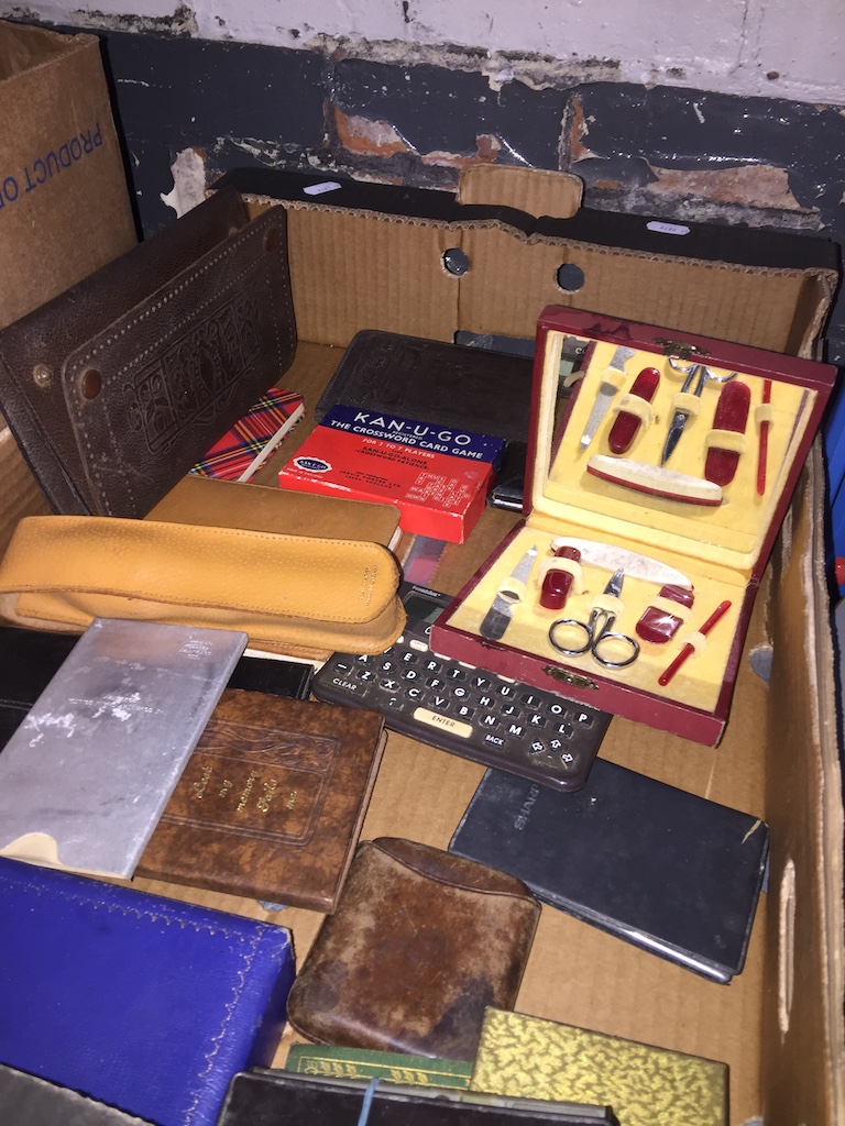 A box of leather wallets, etc Live bidding available via our website, if you require P&P please read